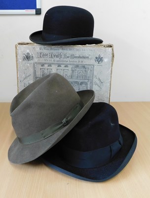 Lot 214 - Three hats, to include a bowler by Dunn & Co.,...