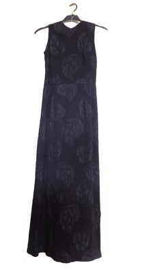 Lot 22 - A c.1960's black shift evening dress, with...