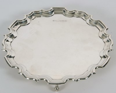 Lot 20 - A sterling silver card salver of plain form,...