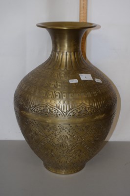 Lot 1 - A modern embossed brass vase