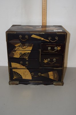 Lot 8 - An Oriental black lacquered table top cabinet