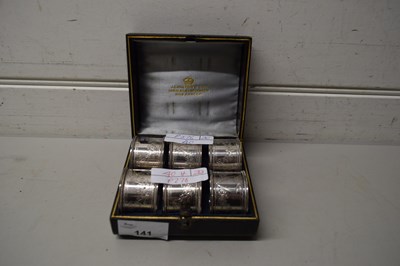 Lot 141 - CASED SET OF SIX SILVER PLATED NAPKIN RINGS,...