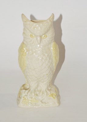 Lot 327 - A Belique porcelain model of an owl with brown...