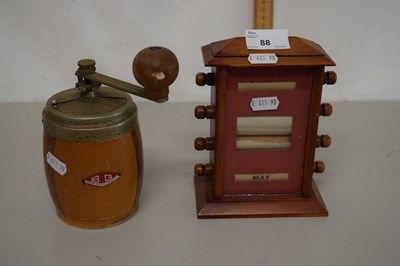 Lot 88 - A desk calendar in stained wooden case...