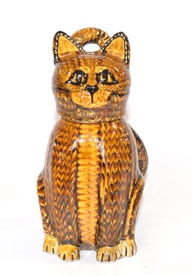 Lot 348 - A Slip ware cat with detachable cover/head,...