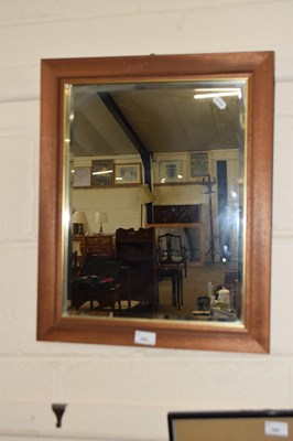 Lot 262 - A modern bevelled wall mirror in hardwood frame