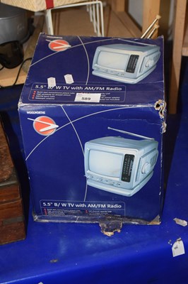 Lot 589 - A 5.5 inch black and white TV with am/fm radio,...