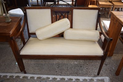 Lot 255 - An Edwardian mahogany framed sofa with cream...