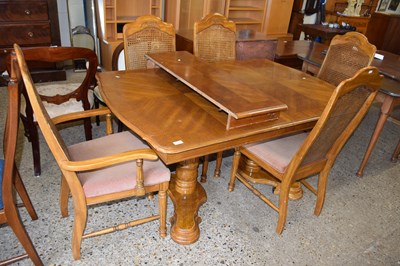 Lot 290 - A reproduction oak veneered extending dining...