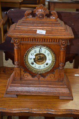 Lot 312 - A late 19th Century oak cased American mantel...