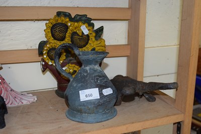 Lot 650 - Cast iron beetle boot scraper, metal jug and a...