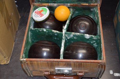 Lot 658 - A cased set of four lawn bowls