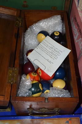 Lot 693 - Wooden box and a quantity of pool balls