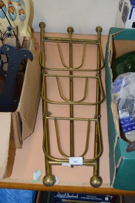 Lot 702 - A three tier folding magazine rack