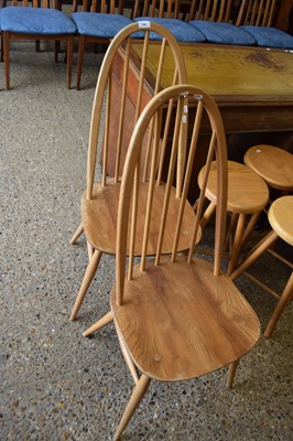 Lot 330 - A pair of Ercol light elm stick back dining...