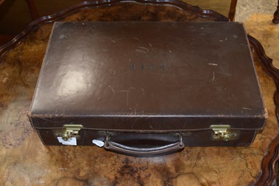 Lot 366 - A brown leather case marked to the interior...