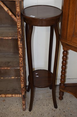 Lot 383 - Edwardian mahogany circular two tier plant stand