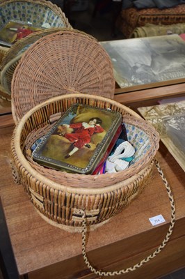 Lot 775 - A sewing basket and contents