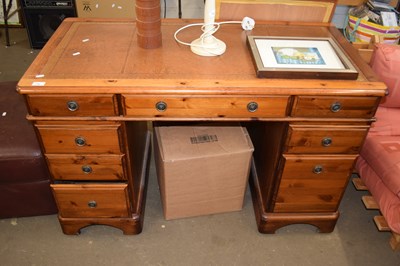 Lot 780 - A pine leather topped twin pedestal desk