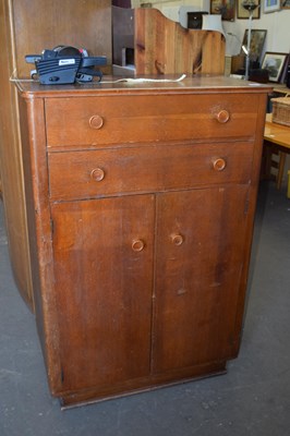 Lot 784 - An oak veneered tall boy cabinet