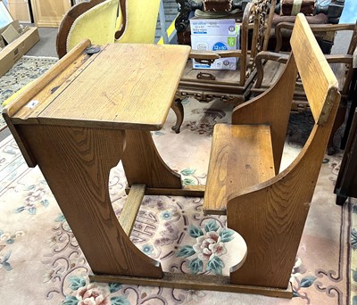 Lot 600 - A mid 20th Century golden oak school desk,...