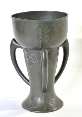 Lot 663 - A German Jugendstil three handled pewter vase...