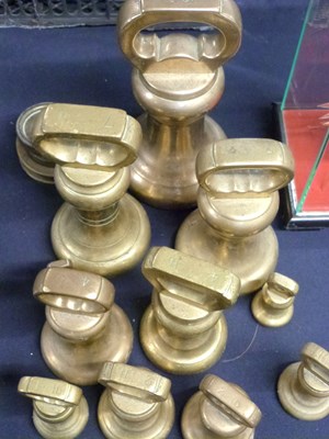 Lot 282 - A group of brass butchers bell weights and...