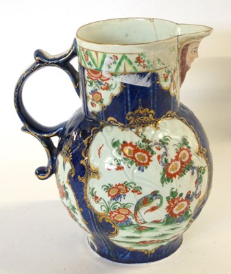 Lot 366 - An 18th Century Worcester mask jug with blue...