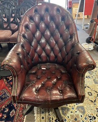 Lot 436 - A distressed red leather Chesterfield style...