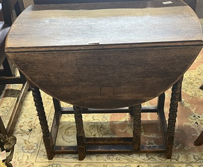 Lot 462 - A small late 19th Century oak drop leaf table...