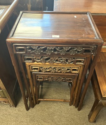 Lot 471 - A nest of four Chinese hardwood tables with...