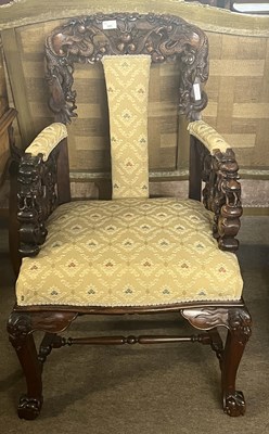 Lot 505 - A 20th Century Chinese hardwood armchair...