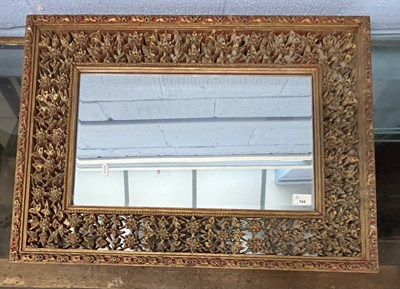 Lot 544 - A 20th Century Oriental wall mirror with...