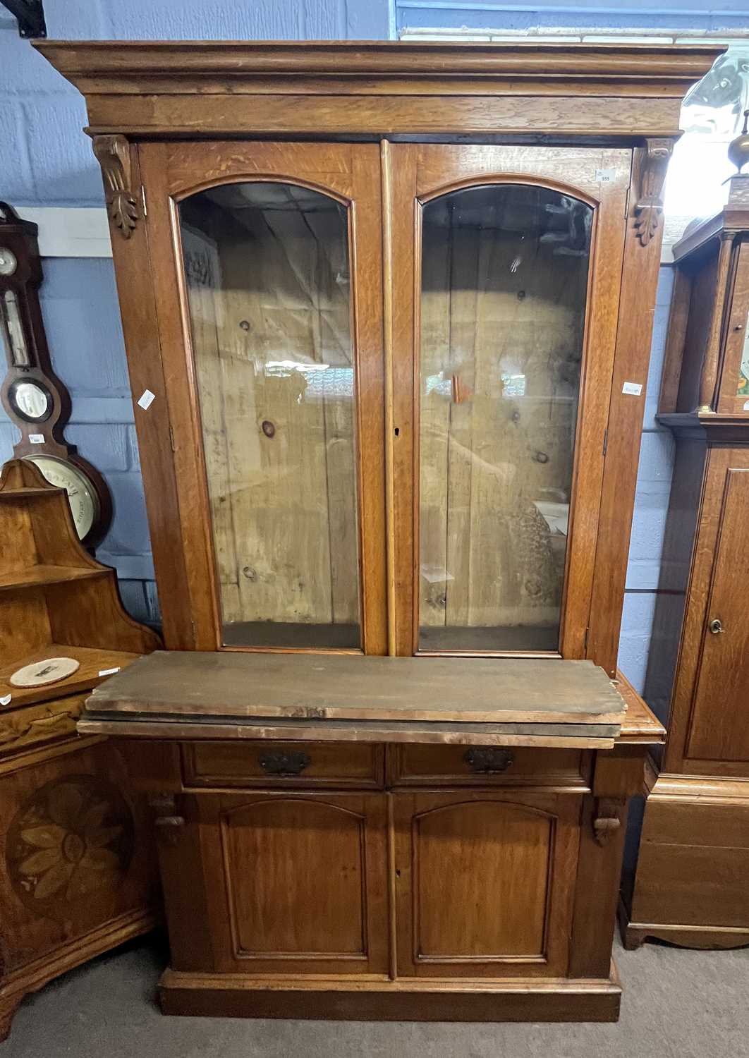 Lot 487 - A late Victorian oak bookcase cabinet formed...