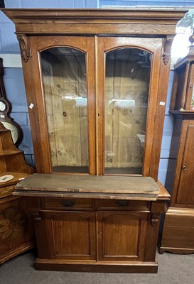 Lot 487 - A late Victorian oak bookcase cabinet formed...