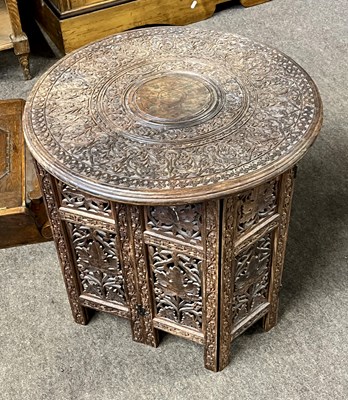 Lot 575 - An Indian hardwood occasional table with...