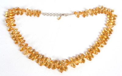 Lot 96 - A citrine necklace, set with graduated...