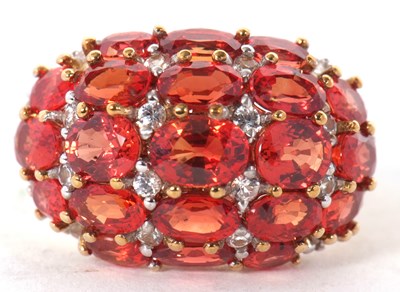 Lot 21 - A 9ct gemset ring, the bombe style ring set...