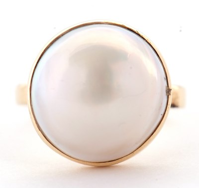 Lot 15 - A 14ct mabe pearl ring, the round cultured...