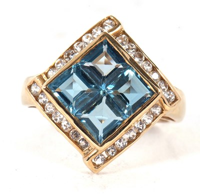 Lot 22 - A 9ct topaz ring, the four square step cut...