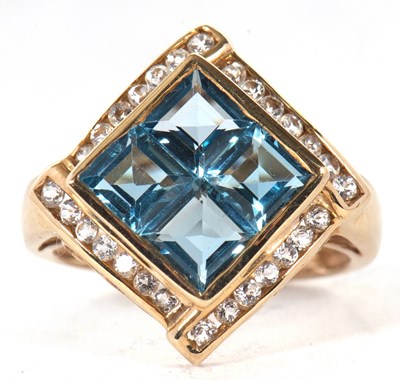 Lot 22 - A 9ct topaz ring, the four square step cut...