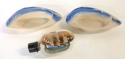 Lot 651 - Two Art Deco dishes, the rims modelled as fish...