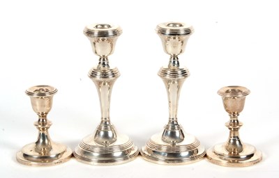Lot 31 - A pair of Elizabeth II silver candlesticks...