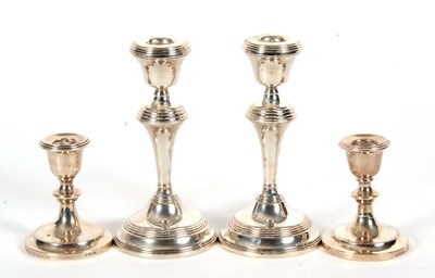 Lot 144 - A pair of Elizabeth II silver candlesticks...