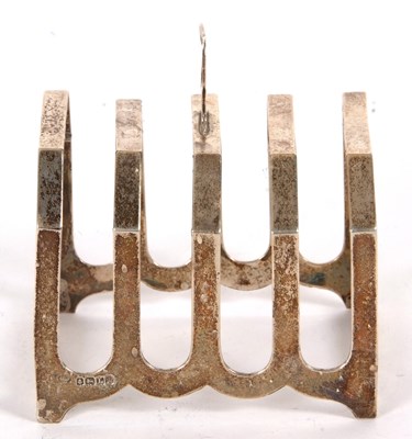 Lot 49 - An Art Deco silver toast rack of angular form,...