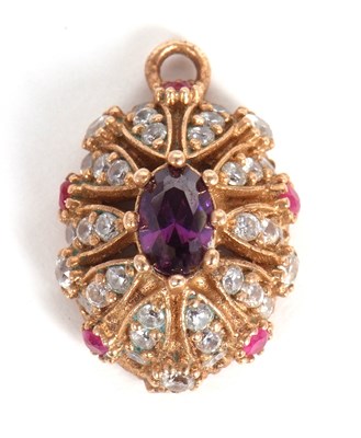 Lot 58 - An amethyst, ruby and white stone pendant, the...