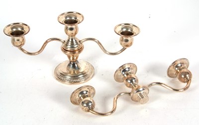 Lot 86 - A small sterling twin branch candelabra, the...