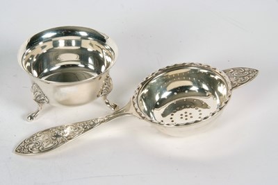 Lot 91 - A hallmarked silver tea strainer and bowl, the...