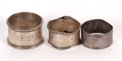 Lot 93 - Three hallmarked silver serviette rings,...