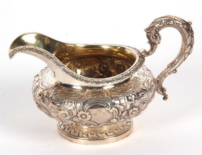 Lot 96 - A William IV silver cream jug of compressed...